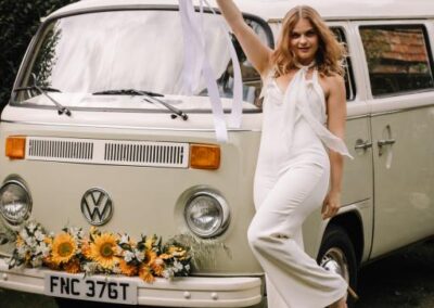 bride with 70s VW Camper wedding car